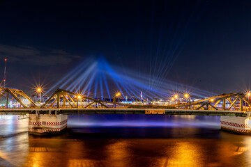 Fototapeta premium The blurred background of fireworks (light trails) is beautiful at night, seen in the New Year holidays, Christmas events, for tourists to take pictures during public travel.