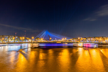 Fototapeta premium The blurred background of fireworks (light trails) is beautiful at night, seen in the New Year holidays, Christmas events, for tourists to take pictures during public travel.