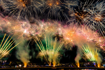 The blurred background of fireworks (light trails) is beautiful at night, seen in the New Year holidays, Christmas events, for tourists to take pictures during public travel.