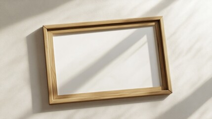 Empty Wooden Frame with Natural Shadow on Wall Ideal for Art Display or Photography Background