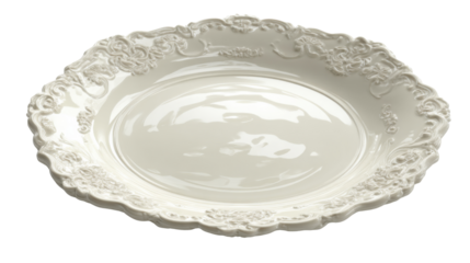 White porcelain plate featuring intricate rococo style ornamentation on its rim, a classic antique serving dish on a transparent background