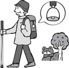 熊よけの鈴をつけて山登りをする男性（シニア）