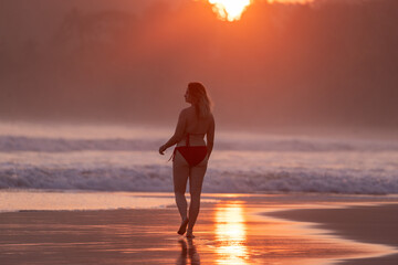 Young Woman Walking Along Talalla Beach at Sunset, Sri Lanka