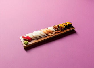 Various sushi on wooden tray