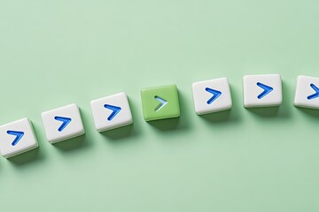 Obraz premium A row of white cubes, each with a blue or pale green arrow, curving on a mint green surface. One cube is a contrasting pale green