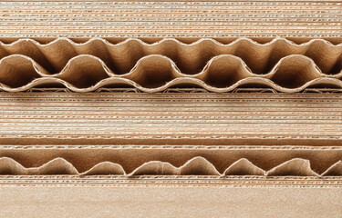 Close-up view of layered corrugated cardboard with wavy inner texture