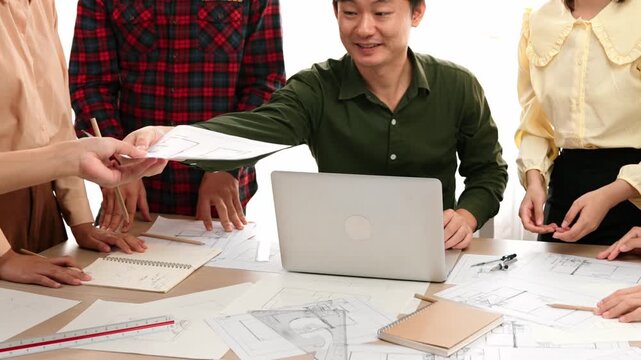 Architect and safety engineer celebrate success design building blueprint project on laptop with architectural document and measurement tool scatter around at modern office. Closeup. Delineation.