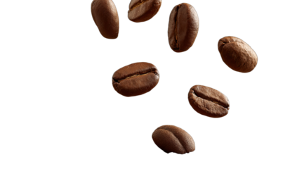 Close-up of rich brown roasted coffee beans falling in darkness