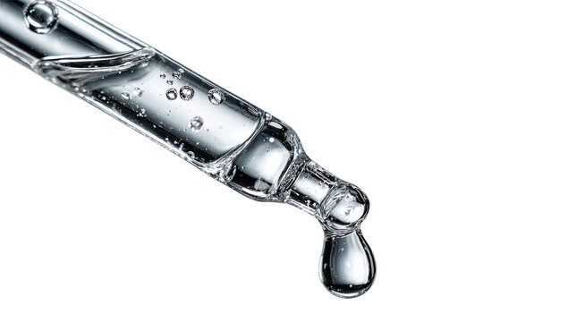 Clear liquid with bubbles drips from a glass pipette tip on black