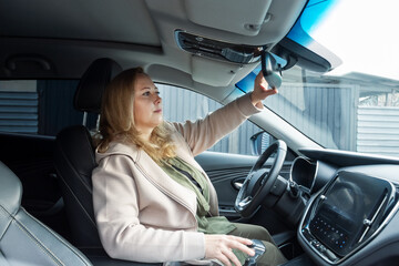 Middle-Aged Caucasian Woman Driver. Female Commuting on a Road Trip or Daily Journey.