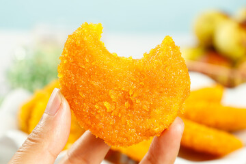 Crispy Fried Pumpkin Cake - Delicious Chinese Pastry in Hand