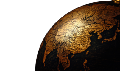 Detailed view of a golden antique globe, showing Asia against a dark background