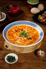Traditional Chinese Hot and Sour Soup with Fresh Noodles and Spicy Broth