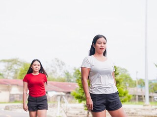 Fitness woman couple light exercise happy stretching outdoor winter workout in morning routine park holiday. Healthy lifestyle people self care wellness planning new beginnings new year transformation