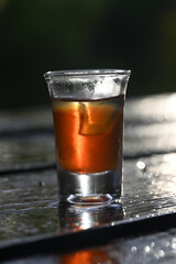 Red plum wine illuminated by light