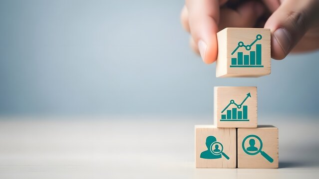 Hands building a block tower with business growth and data analysis icons - Powered by Adobe