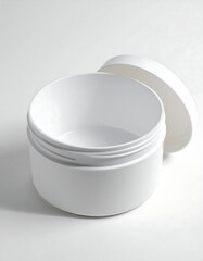Close-up shot of an open, white, cylindrical plastic container with its lid slightly off to the side, set against a white background