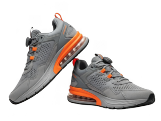 Pair of grey athletic shoes with orange accents isolated on transparent background