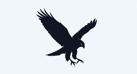 Silhouette of a majestic eagle in flight with wings spread wide, preparing to land.