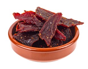 Close-up shot of seasoned, sliced, dried meat snacks overflowing a round, ceramic bowl. The food product has a deep reddish-brown color