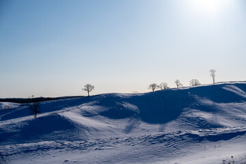 Shadows of the winter hills painted by the morning light