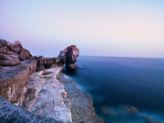 Sea side rock formation at sundown