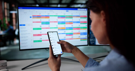 Woman Multitasking With Email And Calendar On Electronic Devices Online