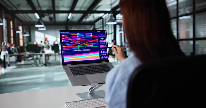 Female Analyst Examining Financial Sankey Chart
