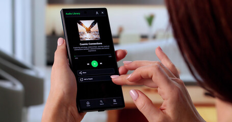 Young Woman Selecting Songs On Smartphone, Aspiring DJ