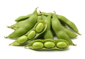 Vibrant green immature soybean pods are piled together with some cracked open to display the seeds