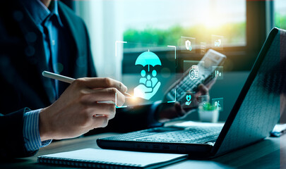 Business professional reviewing digital insurance solutions with holographic protection icons, symbolizing family security, financial safety, modern insurance planning, innovative InsurTech services