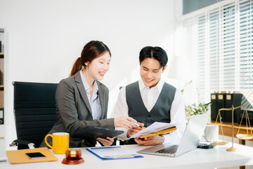 Professional female lawyers consulting on legal cases in a modern office. Perfect for law, business, justice, and teamwork