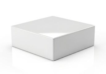 Smooth, glossy white three dimensional square shape rests on a reflective surface