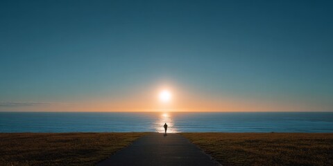 Runner facing the sunrise by the ocean