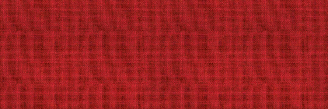 Red fabric background &ndash; seamless texture of textile material. Long wide solid red backdrop of woven linen cloth swatch.