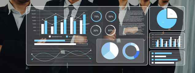A dynamic business team reviews digital data trends displayed through graphs and pie charts, symbolizing organizational performance in a professional setting. Gantry