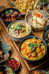 mix of traditional thai curries on restaurant table in phuket thailand
