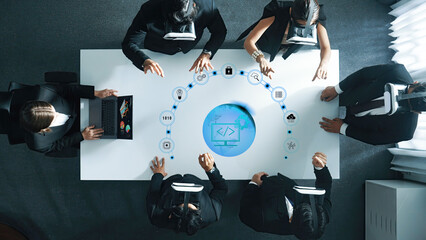 A team of business professionals engages in virtual reality for collaborative project development, showcasing innovation and teamwork in a modern office setting. Trope