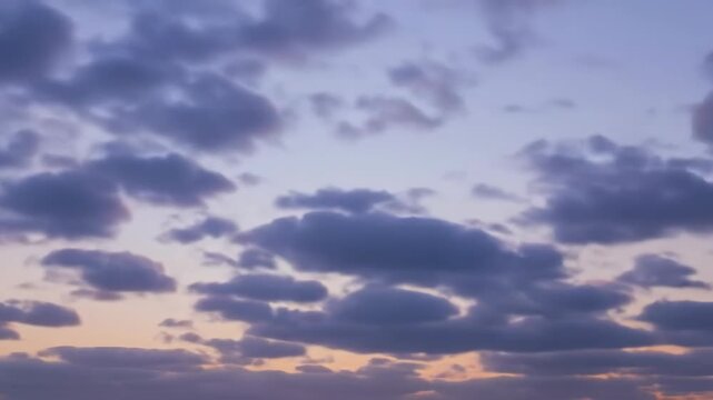 Altocumulus clouds illuminated by pastel sunset light