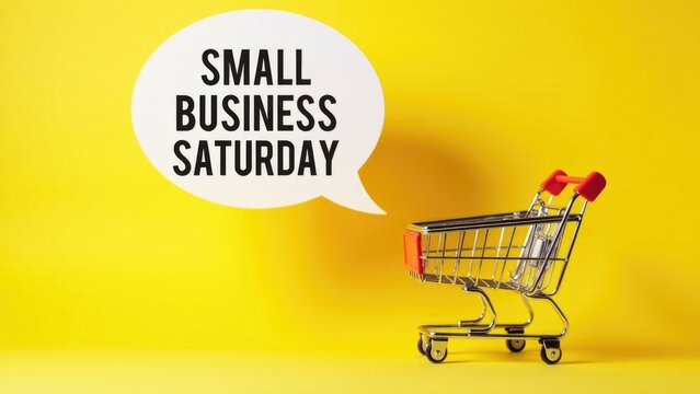 A shopping cart with a speech bubble promoting Small Business Saturday, perfect for use in holiday marketing campaigns or advertisements - Powered by Adobe