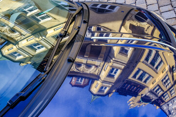 typical reflection of a facade at a car