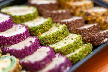 Assorted Turkish delight, rahat lokum, displayed on a market counter for sale