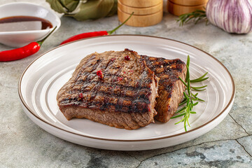 Grilled juicy beef steak with pepper