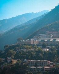 view from the top of the mountain, sun rays falling on the buildings and mountains