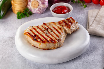 Tasty hot grilled bone steak served sauce