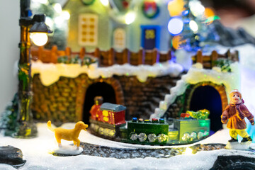 A beautifully crafted Christmas music box featuring reindeer, Santa figures, festive dolls, and a rotating carousel. The intricate design, warm lighting, and nostalgic holiday motifs create a magical 