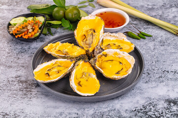 Baked oyster with cheddar cheese