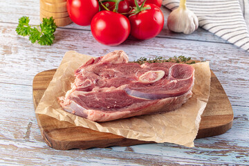 Raw lamb steak with bone