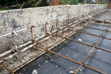 Reinforced concrete structure under construction, which is part of the awning.