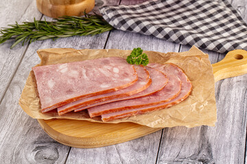 Sliced porjk ham over boatd